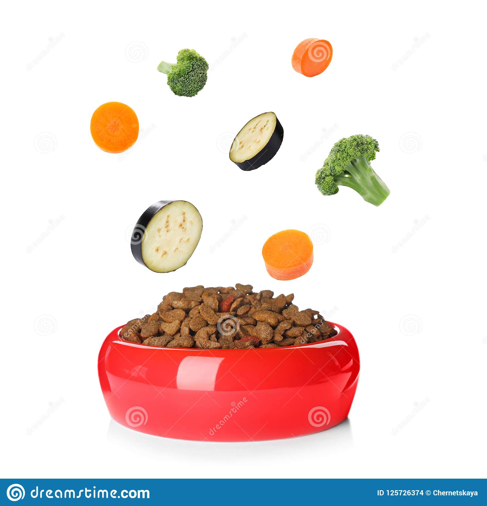 Fresh Ingredients Falling into Bowl with Dry Pet Food Stock Photo ...